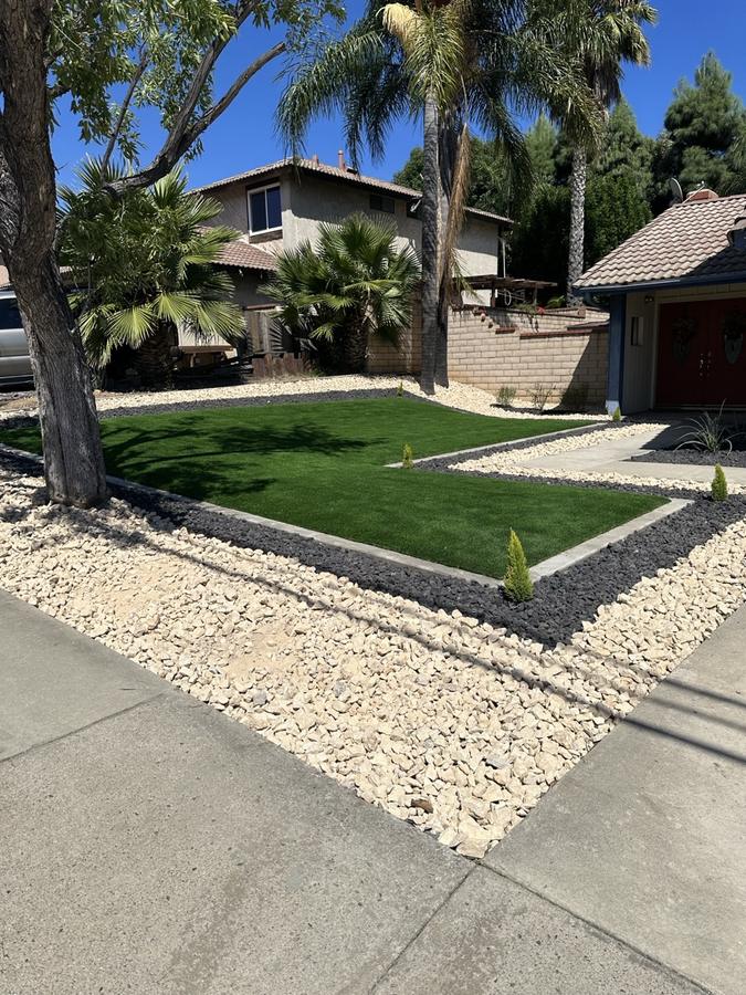 After: artificial turf + decorative rock by Save Aqua Landscapes