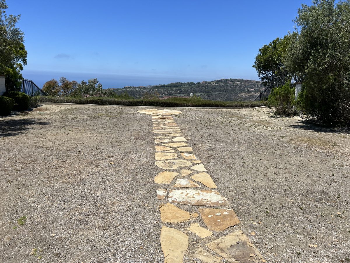 Flagstone paver walkway with a hillside view