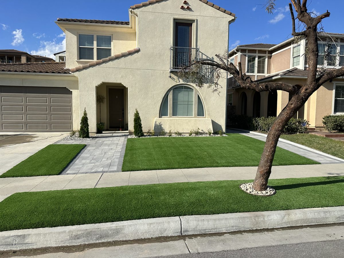 Lush artificial turf front lawn on a Spanish-style Inland Empire home