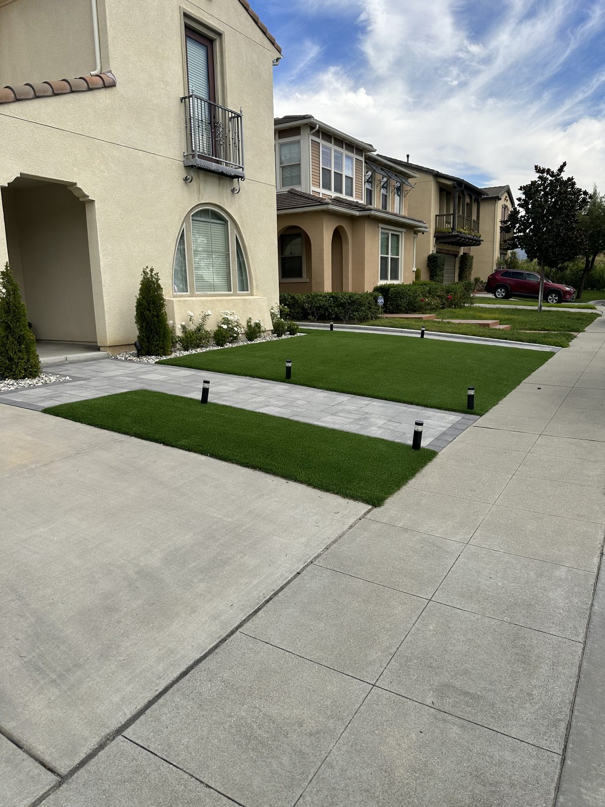 Fresh artificial turf front lawn on a two-story Inland Empire home